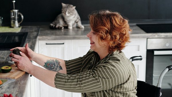 Woman cooks some healthy food in the kitchen - Mental Health  