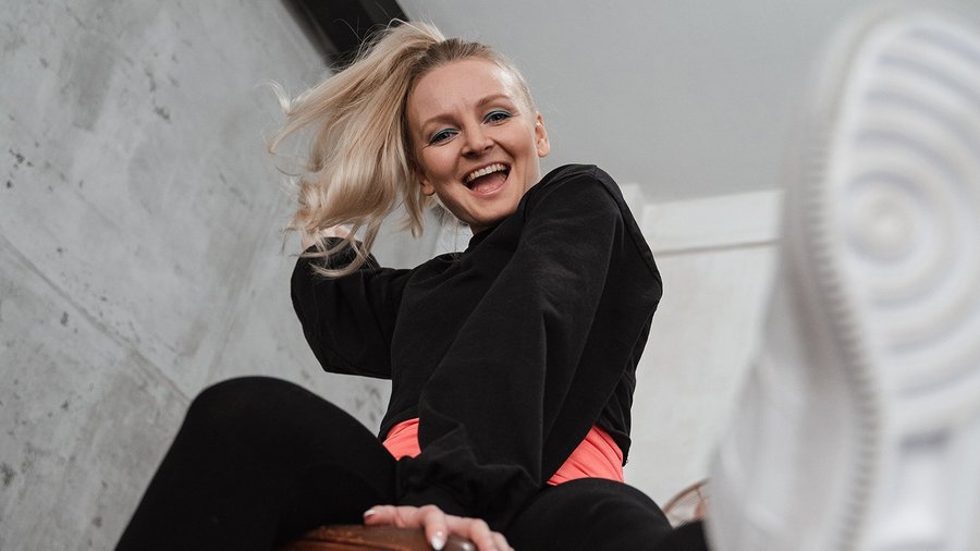 Woman doing gymnastics exercise and laughing – Fit at work