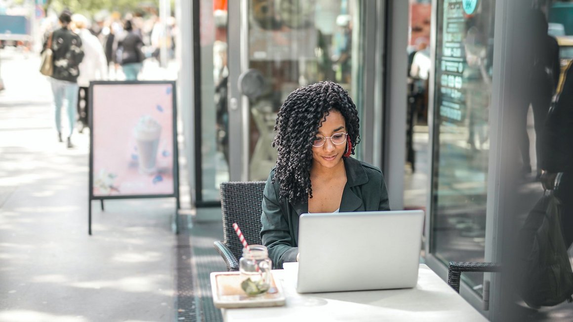 Woman working in a café - Work-life integration