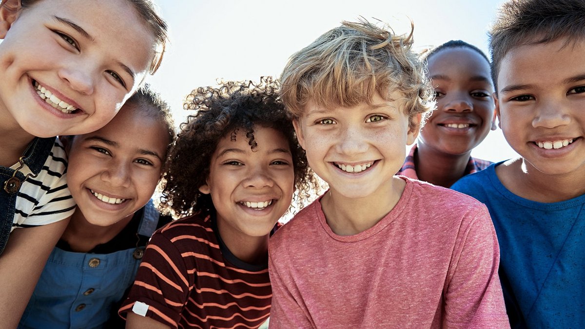 Children smile at the camera