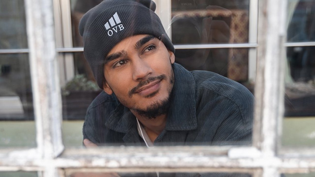 Man looking through a window