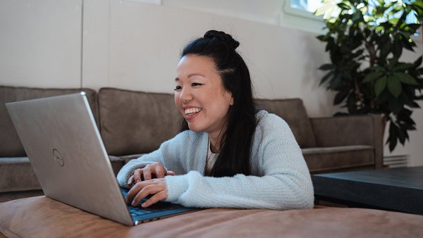 Reduce stress levels Young woman working on her laptop with motivation