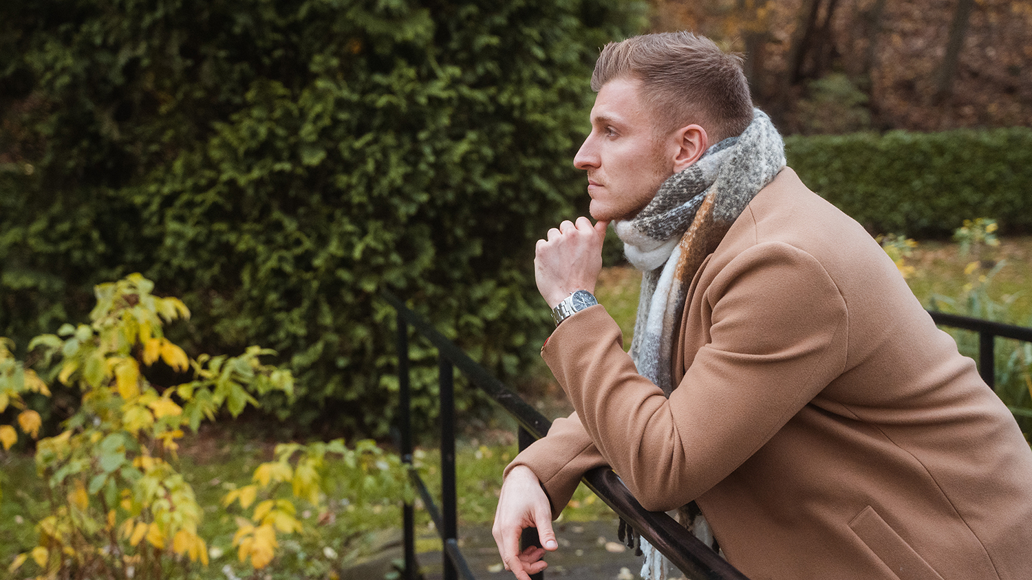 A man looks into the distance, deep in thought