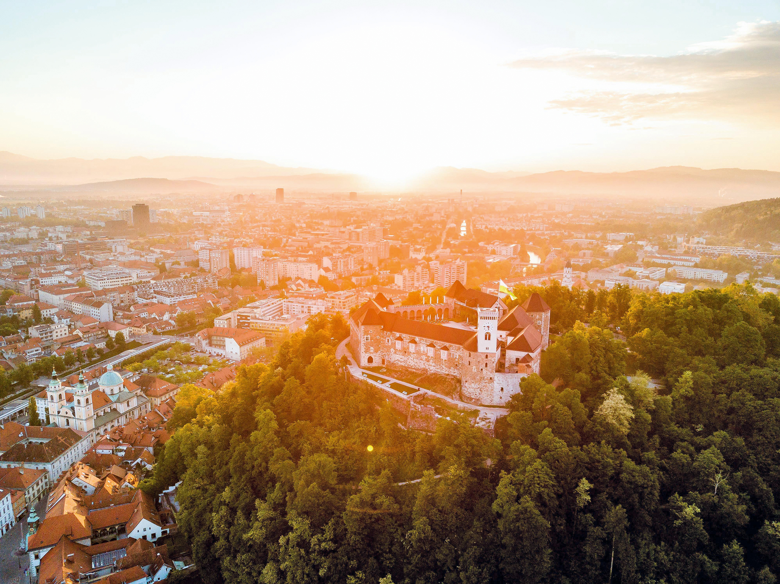 OVB has commenced operations in Slovenia Sunrise over a castle on a mountain