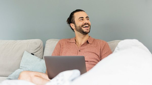 Man with laptop on the couch