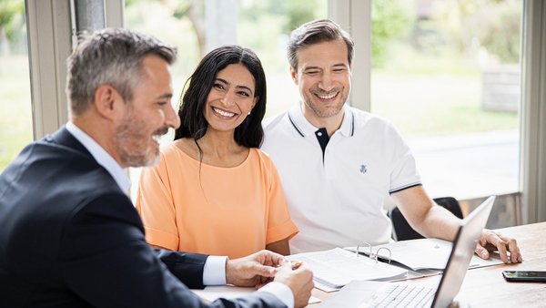 Financial consultant in conversation with couple