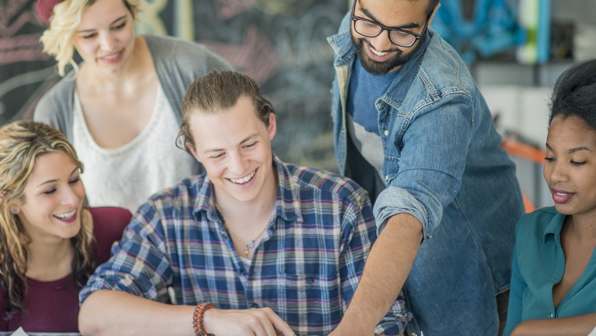 Group of young people working together