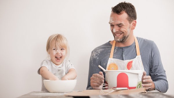 Father and child bake together